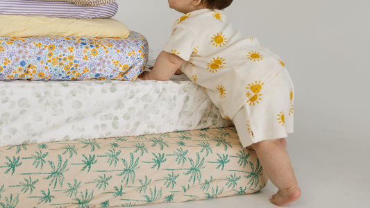 Baby crawling up various sized mattresses