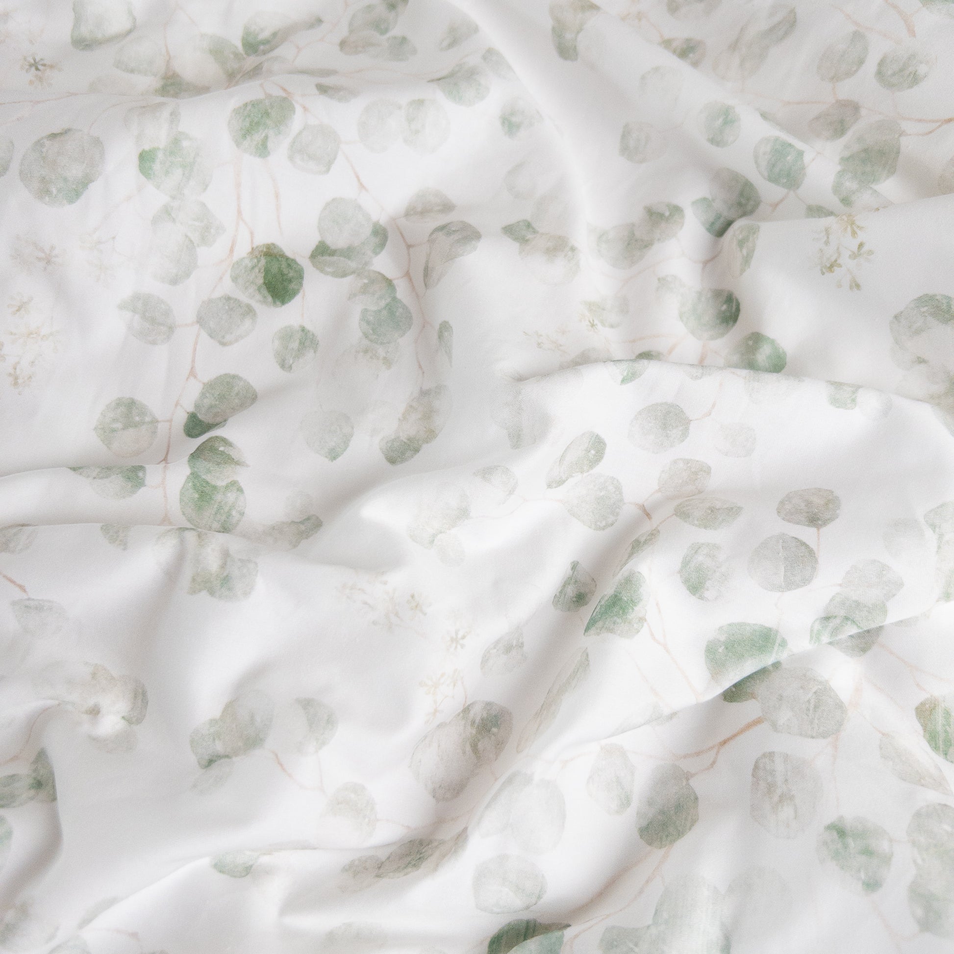 Close-up of eucalyptus organic cotton waterproof fabric used in Little Human Linens fitted sheet, showing soft textured weave