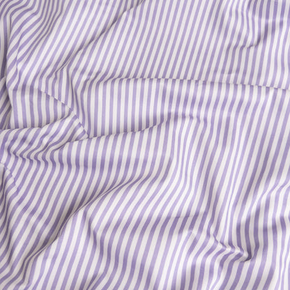 Close-up of lavender stripe organic cotton waterproof fabric used in Little Human Linens fitted sheet, showing soft textured weave