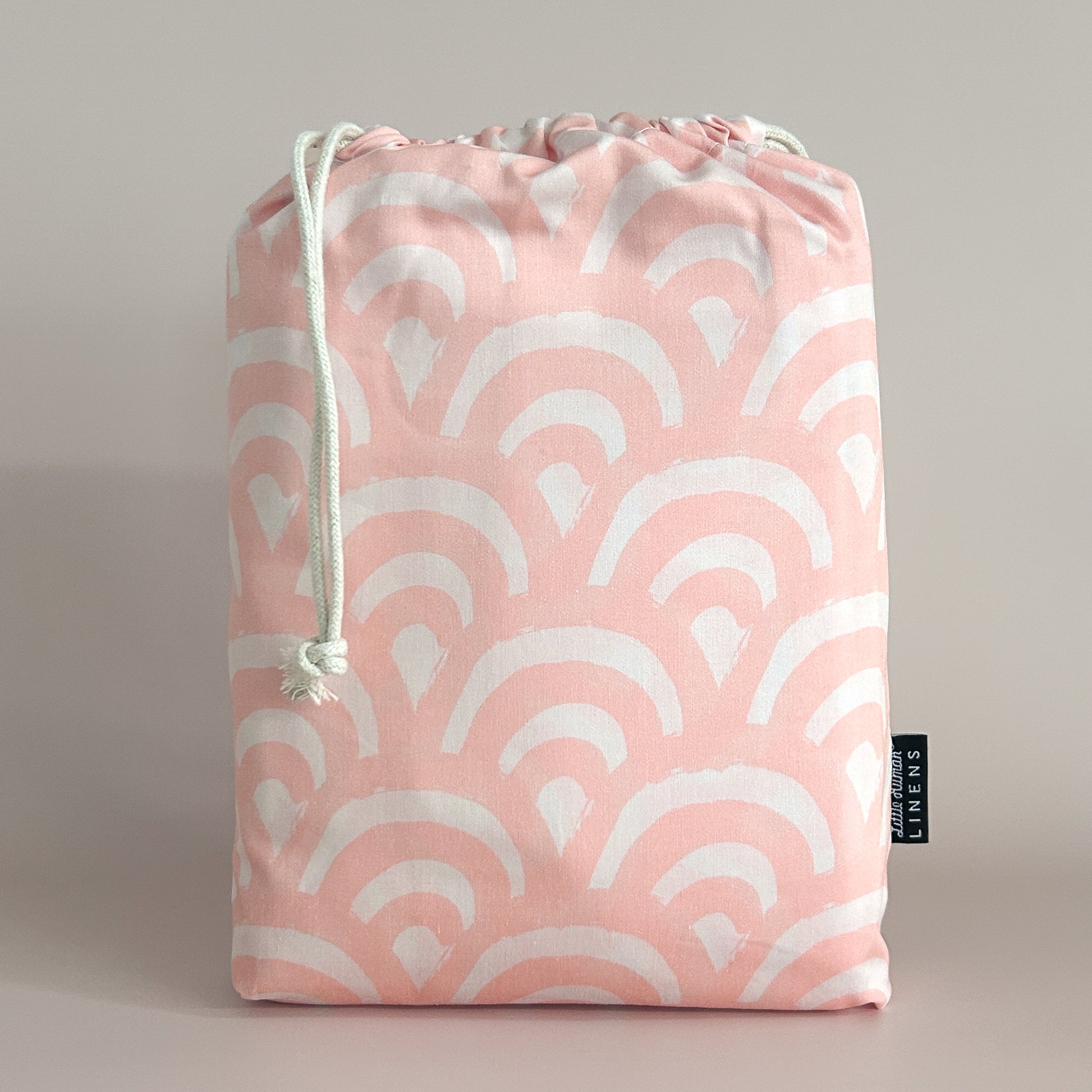 Little Human Linens Peach Rainbows european cot waterproof fitted sheet in branded reusable packaging bag
