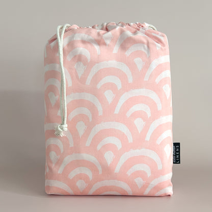Little Human Linens Peach Rainbows european cot waterproof fitted sheet in branded reusable packaging bag