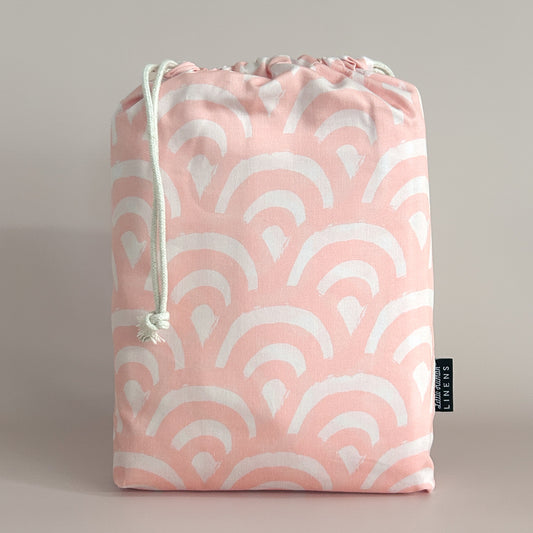 Little Human Linens Peach Rainbows european cot waterproof fitted sheet in branded reusable packaging bag