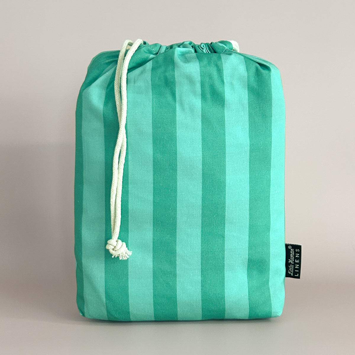 Little Human Linens Mint Candy european cot waterproof fitted sheet in branded reusable packaging bag