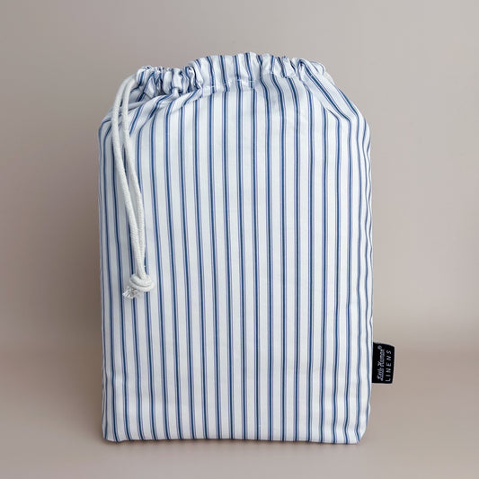 Little Human Linens Navy Ticking european cot waterproof fitted sheet in branded reusable packaging bag
