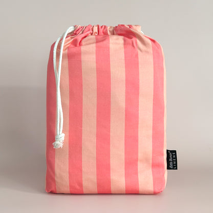 Little Human Linens Peach Candy european cot waterproof fitted sheet in branded reusable packaging bag