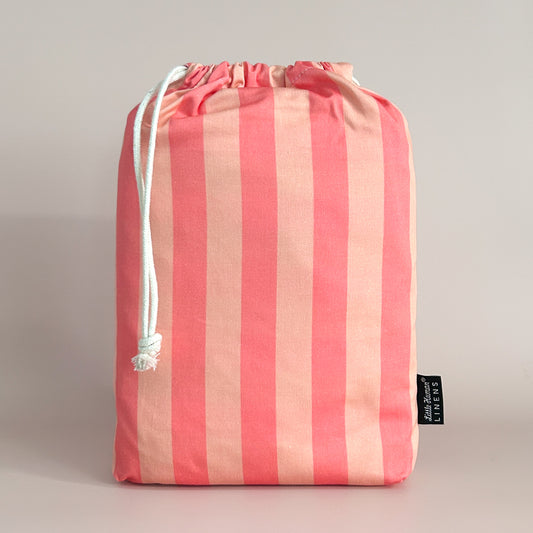 Little Human Linens Peach Candy european cot waterproof fitted sheet in branded reusable packaging bag