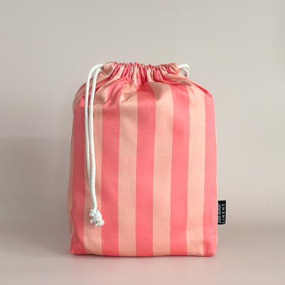 Little Human Linens Peach Candy mini cot waterproof fitted sheet in branded reusable packaging bag