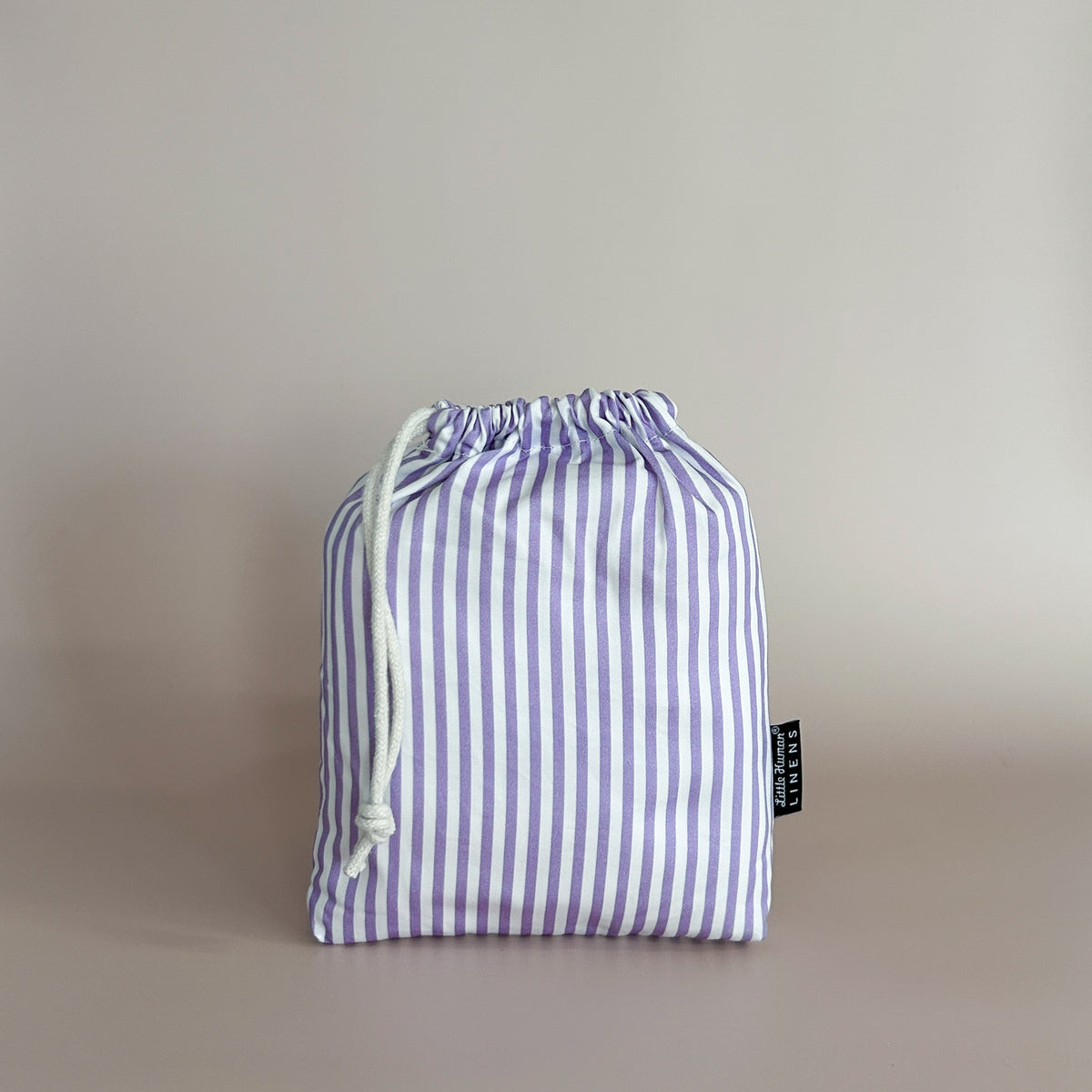 Little Human Linens Lavender Stripe small bassinet waterproof fitted sheet in branded reusable packaging bag