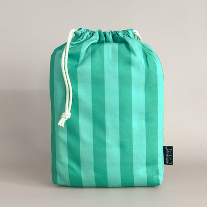 Little Human Linens Mint Candy standard cot waterproof fitted sheet in branded reusable packaging bag