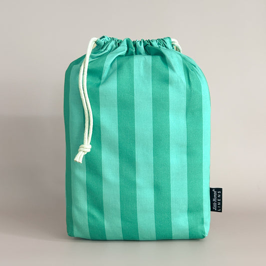 Little Human Linens Mint Candy standard cot waterproof fitted sheet in branded reusable packaging bag