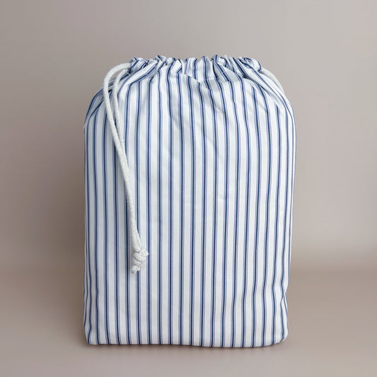 Little Human Linens Navy Ticking standard cot waterproof fitted sheet in branded reusable packaging bag