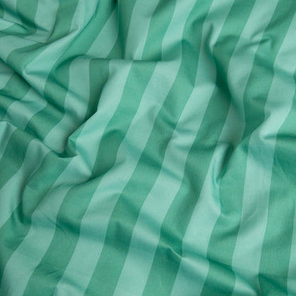 Close-up of mint candy organic cotton waterproof fabric used in Little Human Linens fitted sheet, showing soft textured weave