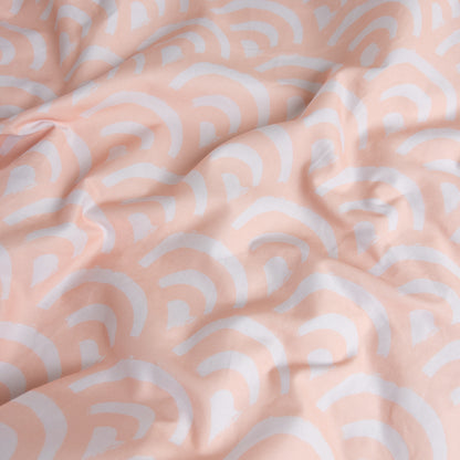 Close-up of peach rainbows gingham organic cotton waterproof fabric used in Little Human Linens fitted sheet, showing soft textured weave
